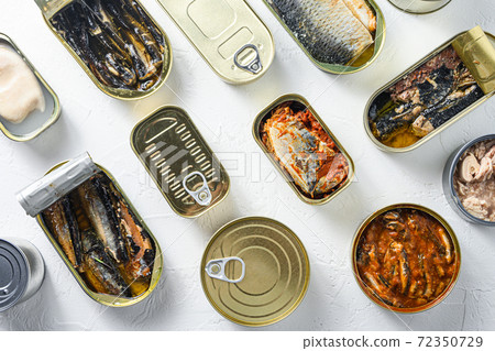 opened cans with different types of fish and 72350729