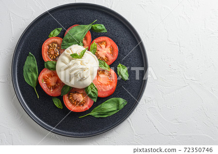 Salad with traditional italian burrata cheese made Salad with traditional italian burrata cheese made 72350746
