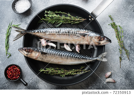 Whole mackerel fish with ingredients on grey 72350913