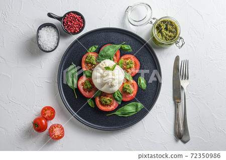 Salad with traditional italian burrata cheese made Salad with traditional italian burrata cheese made 72350986