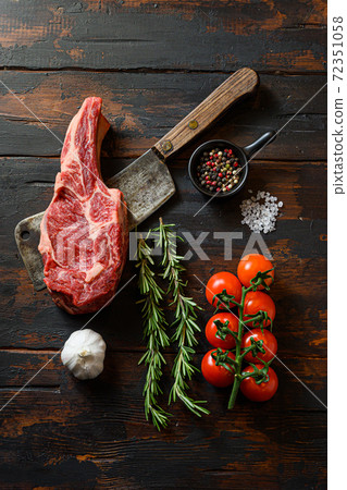 Fresh tomahawk steak on meat cleaver. Organic farm 72351058
