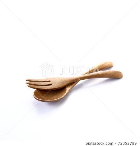 Close up wooden fork and spoon on white 72352789