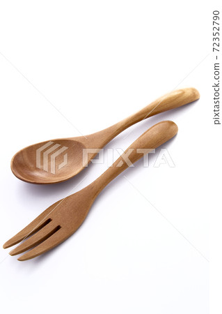 Close up wooden fork and spoon on white 72352790