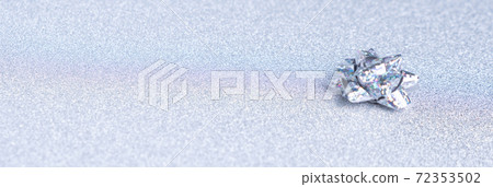 holographic bow on a shiny silver background 72353502