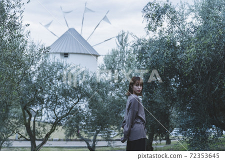 Woman in olive park Woman in olive park 72353645