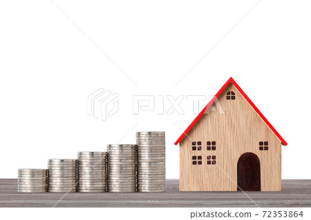 Business property investment concept, model house and stacking coins saving growth on wooden desk on white background studio for financial real estate advertising concept 72353864
