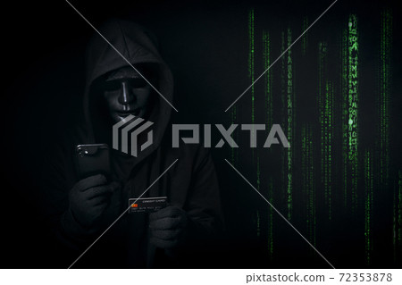 Dangerous anonymous hacker in hooded and mask use smartphone and credit card, break security data and hack password with Bank data account as binary code. Internet crime, cyber attack security concept 72353878