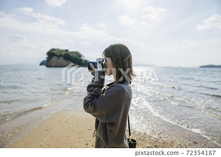 Woman traveling by sea Woman traveling by sea 72354187