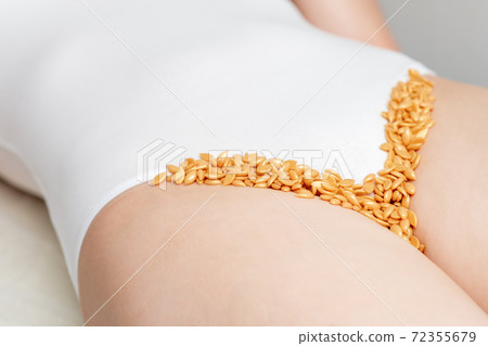 Wax beans in row in bikini zone. 72355679