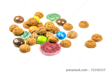 Bunch of pepernoten cookies, sweets and chocolate money frontal view 72356337