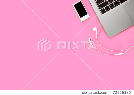 break time on technology working business table with smartphone, musical player, ear phone and computer on pink pastel background break time on technology working business table with smartphone, musical player, ear phone and computer on pink pastel background 72356380