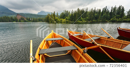 Boats on mountain lake Strbske pleso in Slovakia. Boats on mountain lake Strbske pleso in Slovakia. 72356401