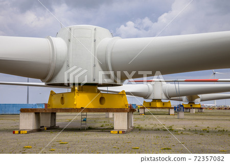 Three Giant rotors of wind turbine on construction yard Three Giant rotors of wind turbine on construction yard 72357082