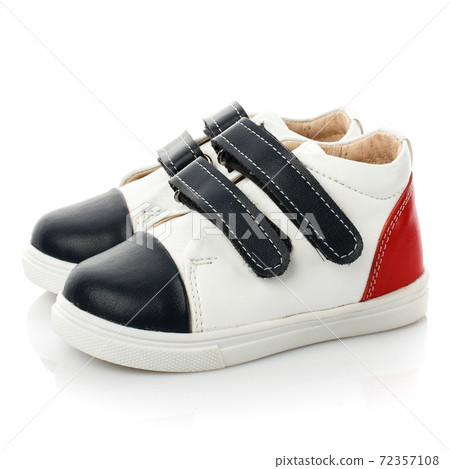 Black and white baby sneakers isolated on white background. Black and white baby sneakers isolated on white background. 72357108
