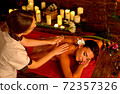 Massage woman back in beauty spa with masseuse 72357326