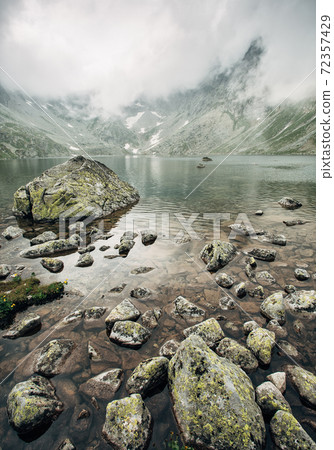 Lake in foggy mountains in the High Tatras. 72357429