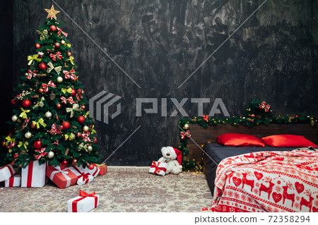 Christmas tree with bed in bedroom New Year holiday gifts Christmas tree with bed in bedroom New Year holiday gifts 72358294