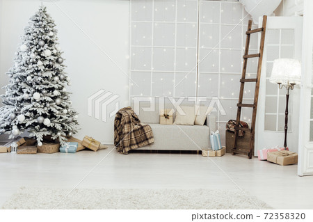 snow Christmas tree with new year gifts in the white room snow Christmas tree with new year gifts in the white room 72358320