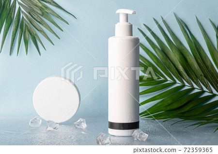 White plastic bottles for creams. On multi-colored backgrounds from Whatman paper. White plastic bottles for creams. On multi-colored backgrounds from Whatman paper. 72359365
