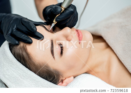 Permanent makeup on eyebrows. 72359618