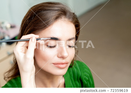Eyebrows makeup of woman. 72359619