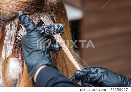 Close up dyeing hair of woman. Close up dyeing hair of woman. 72359637