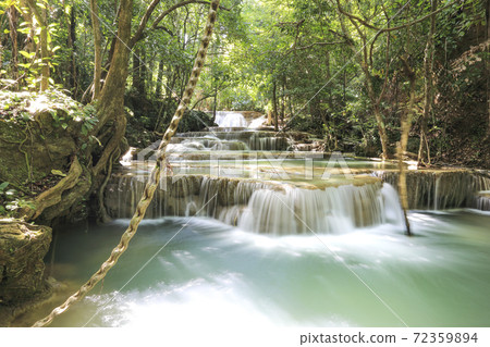 water fall in nature with green trees in Kanchanaburi, Thailand water fall in nature with green trees in Kanchanaburi, Thailand 72359894