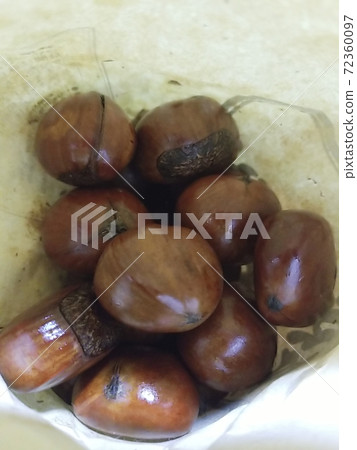 Sweet chestnuts in a paper bag Sweet chestnuts in a paper bag 72360097