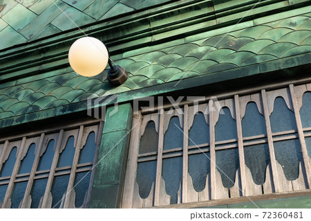 Exterior of the building in the early Showa period: Copper-plated walls and retro lighting 72360481