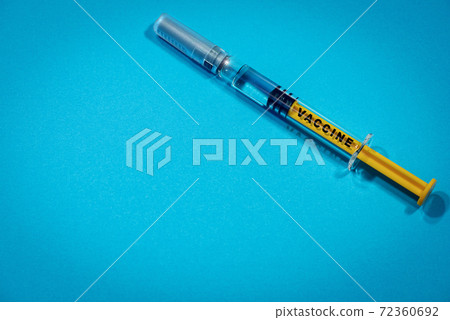 Vaccine Syringe on blue Background with Copy Space 72360692