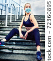 Running fitness sport in medical mask of woman. Coronavirus control 72360895