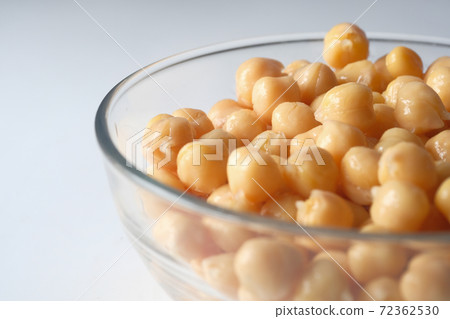chick peas in a bowl on white background  72362530