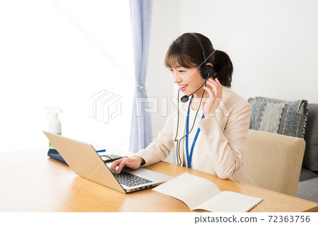 Female operator working online 72363756