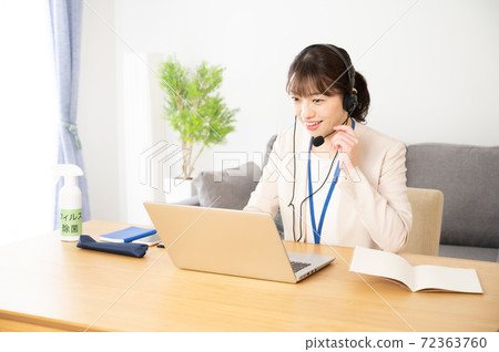 Female operator working online 72363760