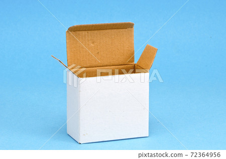 empty open cardboard box on azure background empty open cardboard box on azure background 72364956