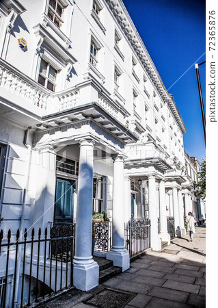 row of white houses in Notting Hill 72365876