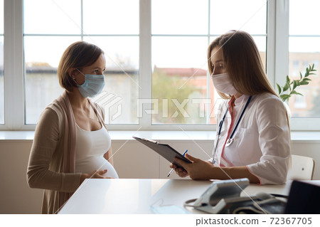 Happy pregnant woman visit gynecologist doctor at hospital or medical clinic for pregnancy Happy pregnant woman visit gynecologist doctor at hospital or medical clinic for pregnancy 72367705