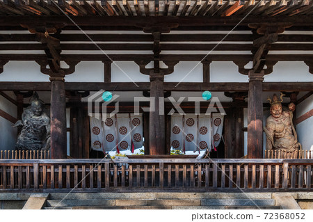 The central gate of Horyuji Temple in Nara that shines in the autumn sky 72368052