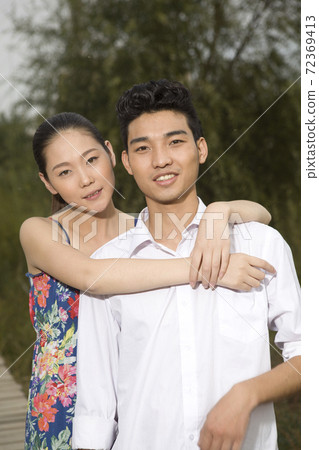 A young couple in the park for an outing 72369413