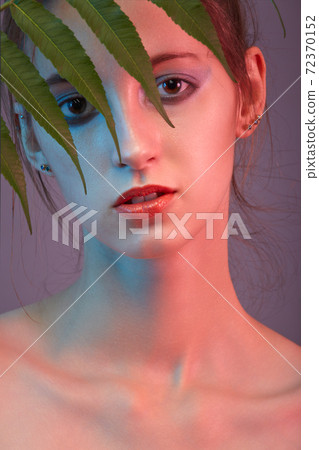 woman with plant 72370152