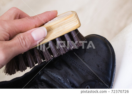 Brush for cleaning shoes in hand and shoes 72370726