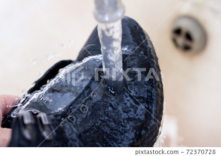 Brush for cleaning shoes in hand and shoes 72370728