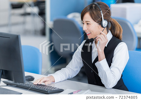 Young woman working in a call center 72374805