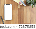 Smartphone with blank white copy space for text, Mockup design desktop computer in office on wood table desktop, Work place concept, Ornamental plant in pot. 72375853