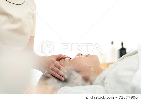 A woman relaxing with beauty treatment A woman relaxing with beauty treatment 72377906