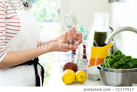 Hands of a woman who cares about rough hands in the kitchen 72377917