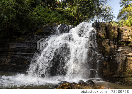 Waterfall in the jungle on the island of Sri Lanka Waterfall in the jungle on the island of Sri Lanka 72380738