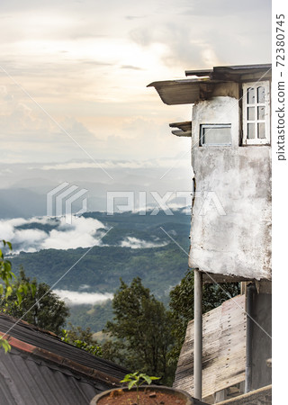 A fragment of a house overhanging a mountain valley on the island of Sri Lanka A fragment of a house overhanging a mountain valley on the island of Sri Lanka 72380745