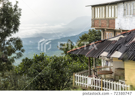 Fragments of house and terrace overhanging a mountain valley on the island of Sri Lanka Fragments of house and terrace overhanging a mountain valley on the island of Sri Lanka 72380747