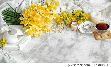 Spring still life with a Cup of tea and flowers . Spring still life with a Cup of tea and flowers . 72380881